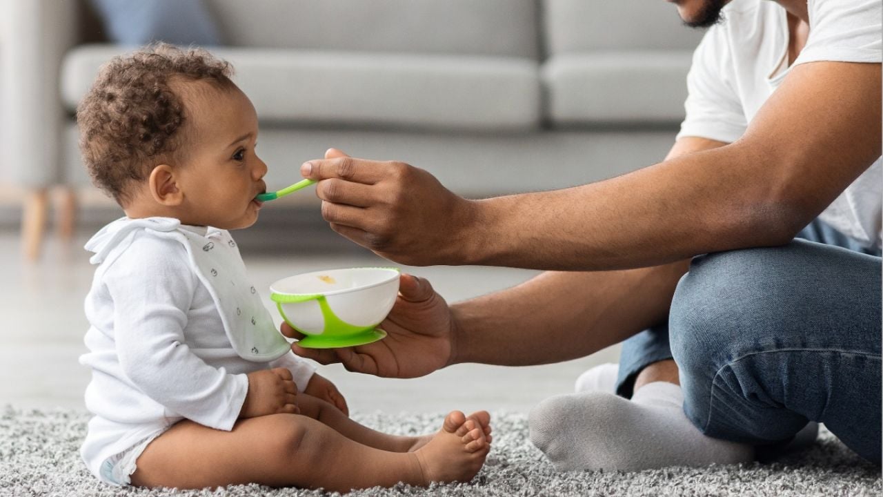 Child being fed baby food