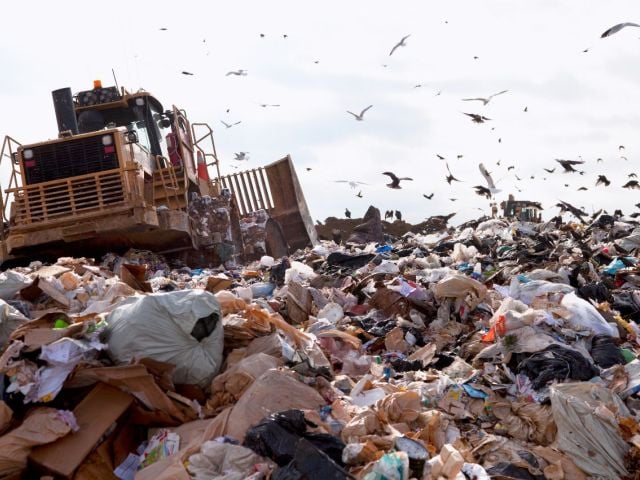 Truck dumping at landfill