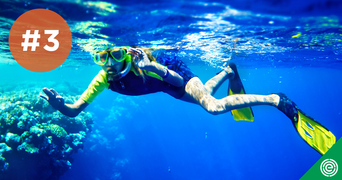 photo of a scuba diver among reefs
